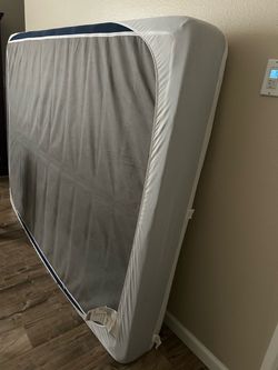 Queen mattress and black bed frame