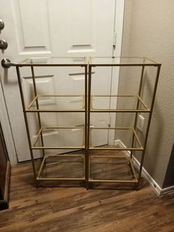 2 stand alone gold and glass shelves