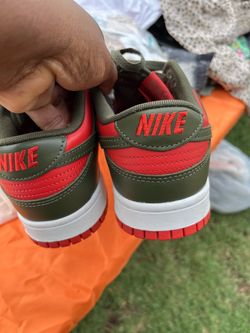 Red and green Nike  tennis shoes