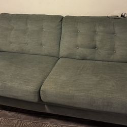 2 Identical mid-century modern designer green Couch