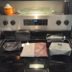 4 Tumi Toiletry Bags & 1 Heshal Travel Beg