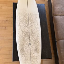 6’4” rusty twin fin fish surfboard