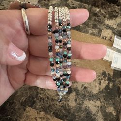 Pulsera con bolita de plata con cinco tiras