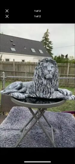 Stone colored lion statue