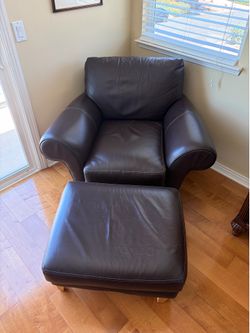 Brown genuine leather chair and ottoman