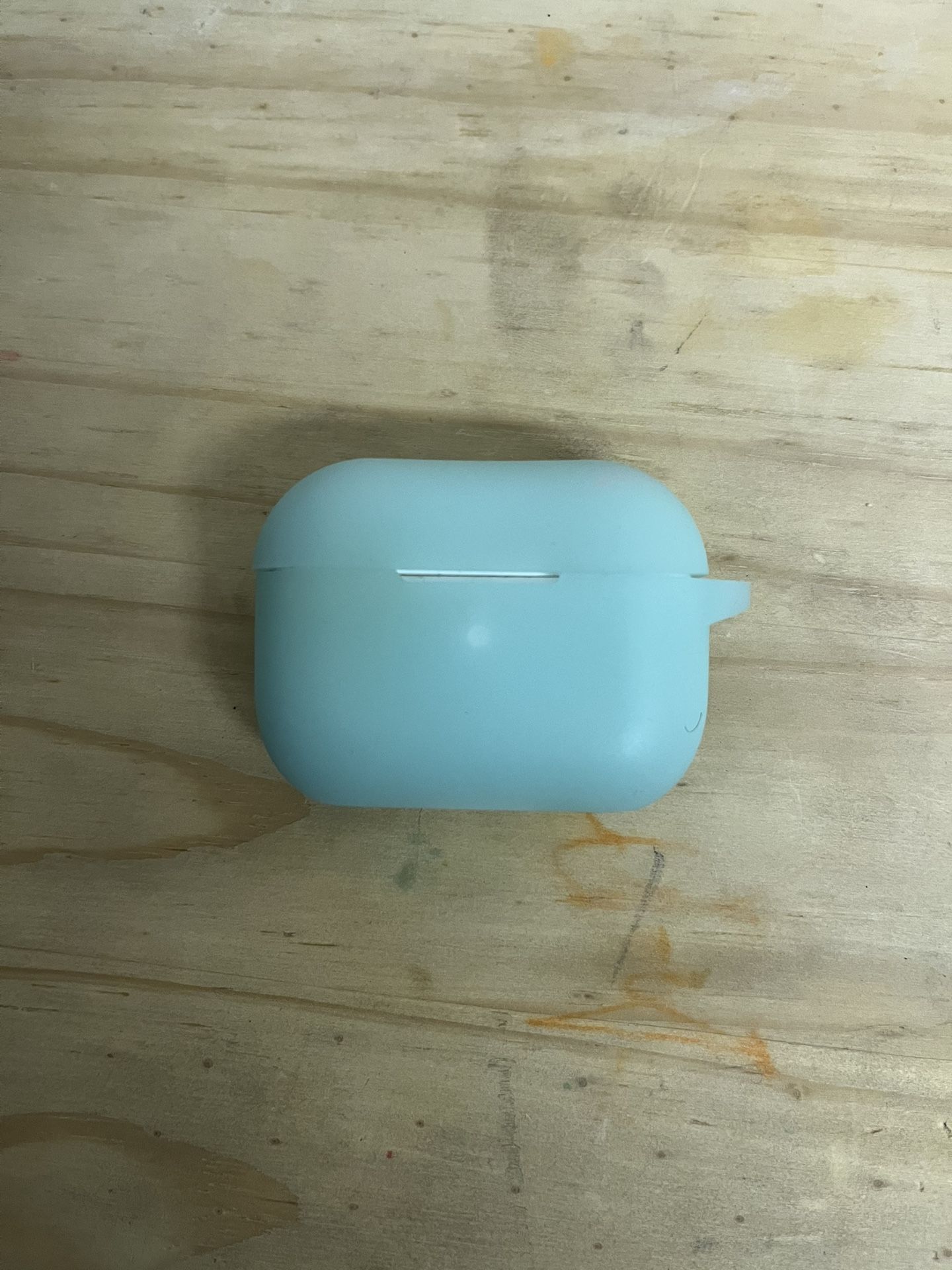 Airpod Pro charging case, left airpod & glow-in-dark case.