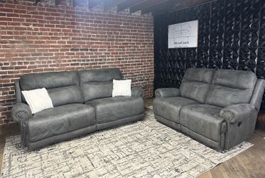 Delivery available - Ashley Furniture gray reclining sofa loveseat couch set
