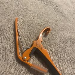 2 Guitar capos. One kyser And One Planet Waves. Both 25