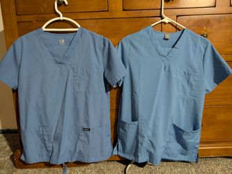 Two sets of ceil blue hospital scrubs