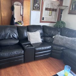 Black Leather sectional with sleeper bed  and coffee table 