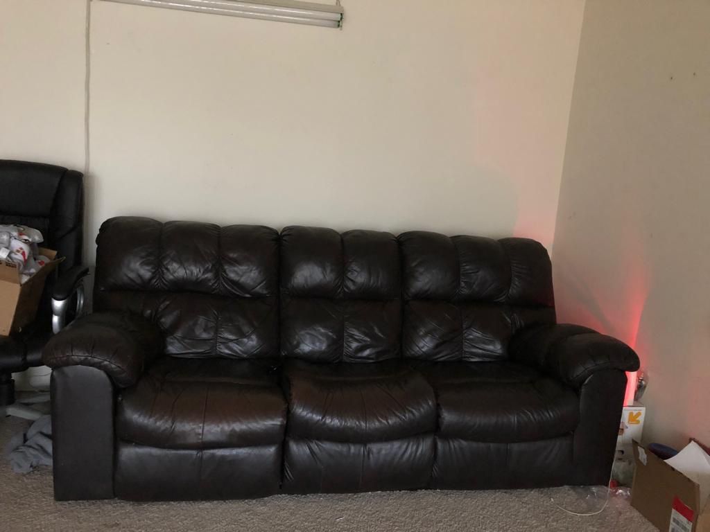 Pure leather reclining Ashley furniture sofa in great condition.