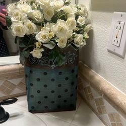 Decorative floral arrangement in beautiful wall mounting vase