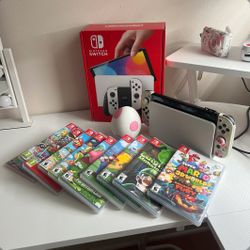 A New Switch Oled Console Bundle With Games And All The Accessories 