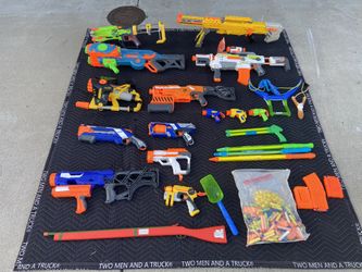 Various NERF toys with darts
