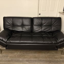 Multi-way adjustable black leather futon