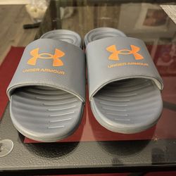 BRAND NEW UNDER ARMOUR SLIDES…SIZE 6Y