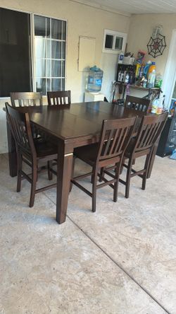 Wooden dining tables and 6 Chairs