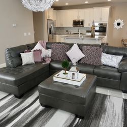 Grey Faux Leather Sectional Couch And Ottoman 