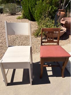 Wooden chairs:  light-colored modern chair and one vintage-style piano chair with a lyre-back design and lip open seat.