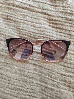 Ted Baker sunglasses with a rose gold frame and gradient pink lenses