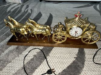 Vintage gold and brass horse-drawn carriage clock