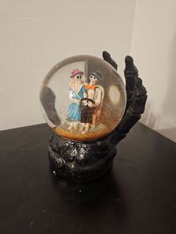 Halloween skeleton couple snow globe