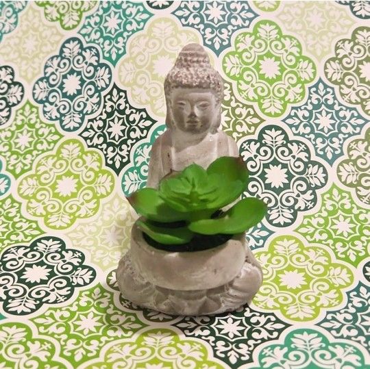 Buddha statue with faux succulent