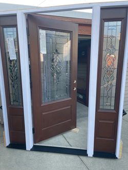 New door fiberglass  feather rivers mohagony color  size w70.1/2 h81.3/4 left hand in swing $2850 jam is 4.9/16