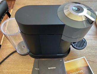 Nespresso Vertuo by Delonghi with $10 coupon code for coffee order