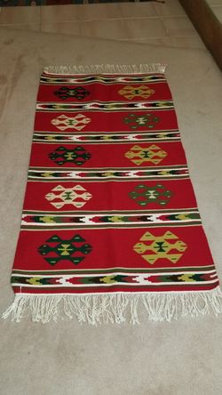 GORGEOUS NEW WITH TAGS. HAND MADE WOOL CARPET. MADE IN ALBANIA. 62X32. PICK UP MIDDLEBORO ONLY FINAL SALE