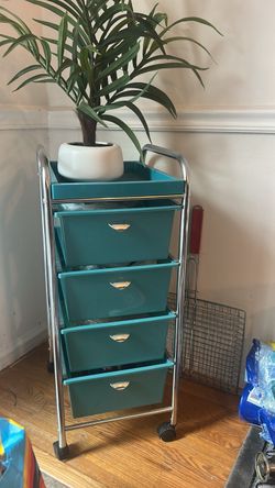4 drawers and fake flower on top