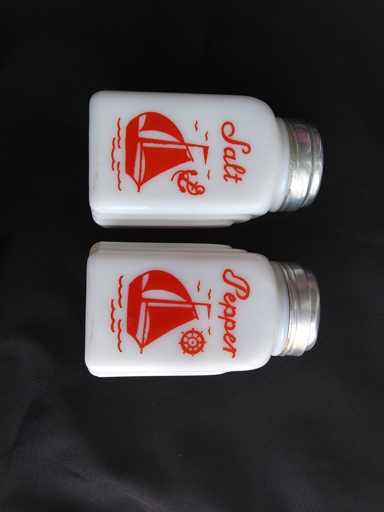 Vintage milk glass salt& Pepper Shakers w/ red sail boats