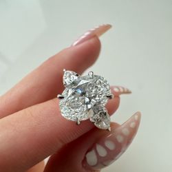 Oval Cut With Side Stones Ring