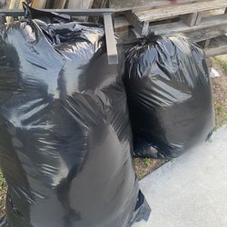 Bags Of Clothes And Pillows