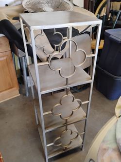 Metal Shelving Unit with Floral Detail