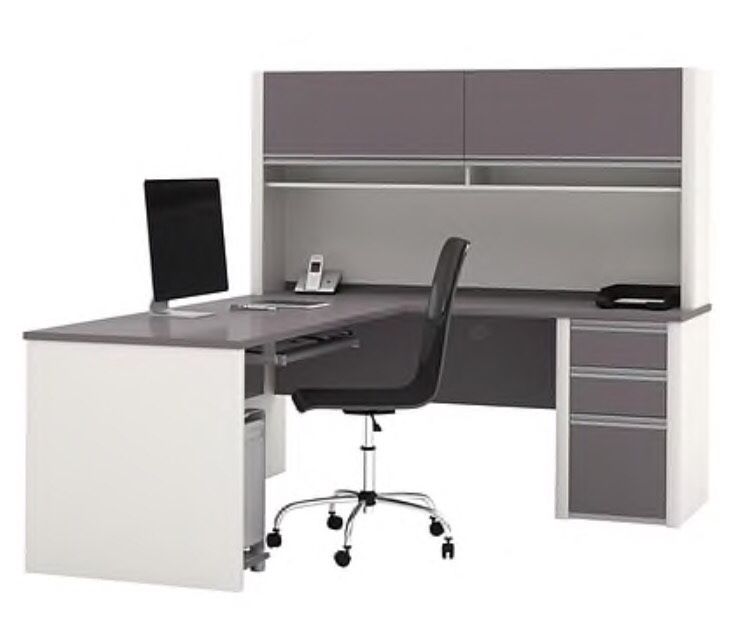 Gray and white L shaped office desk with hutch