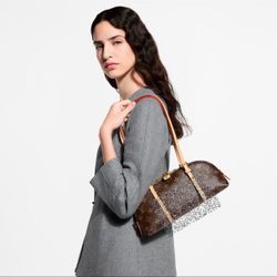 L.   V.   Squire East West bag purse