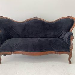 Vintage couch with black fabric. 