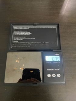 10k gold earrings 0.79 grams (has defect in back)