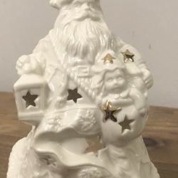 Mikasa Santa Holiday Elegance Christmas White Gold. Candle light, in new like condition, no box, 5” in height this beautiful Santa will sure make your