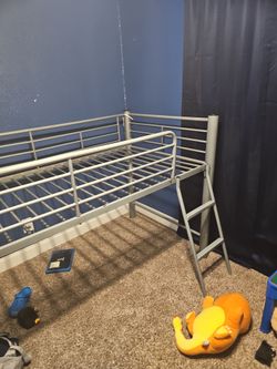 Twin bed, grey.