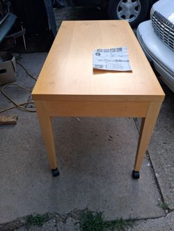 Wood table with wheels (New) in box