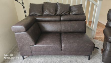 Dark brown faux-leather loveseat