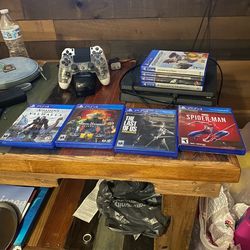 PS4 Slim 500gb bundle with 8 games, 2 controllers, and dual charging station