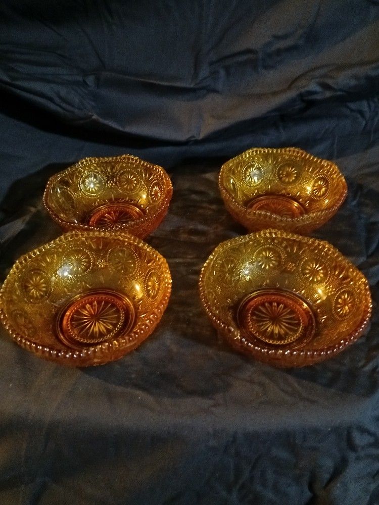 Set Of Four Amber Antique Bows