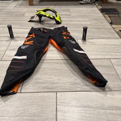 Medium Fly Racing Pants, Flame Grips, A BMX Youth Neck Support, And A Small Fly Racing Helmet