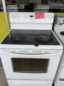 Glass top stove range oven white dent in top works great . Warranty . Delivery available . 2203 Fowler st. Ft. Myers 33901