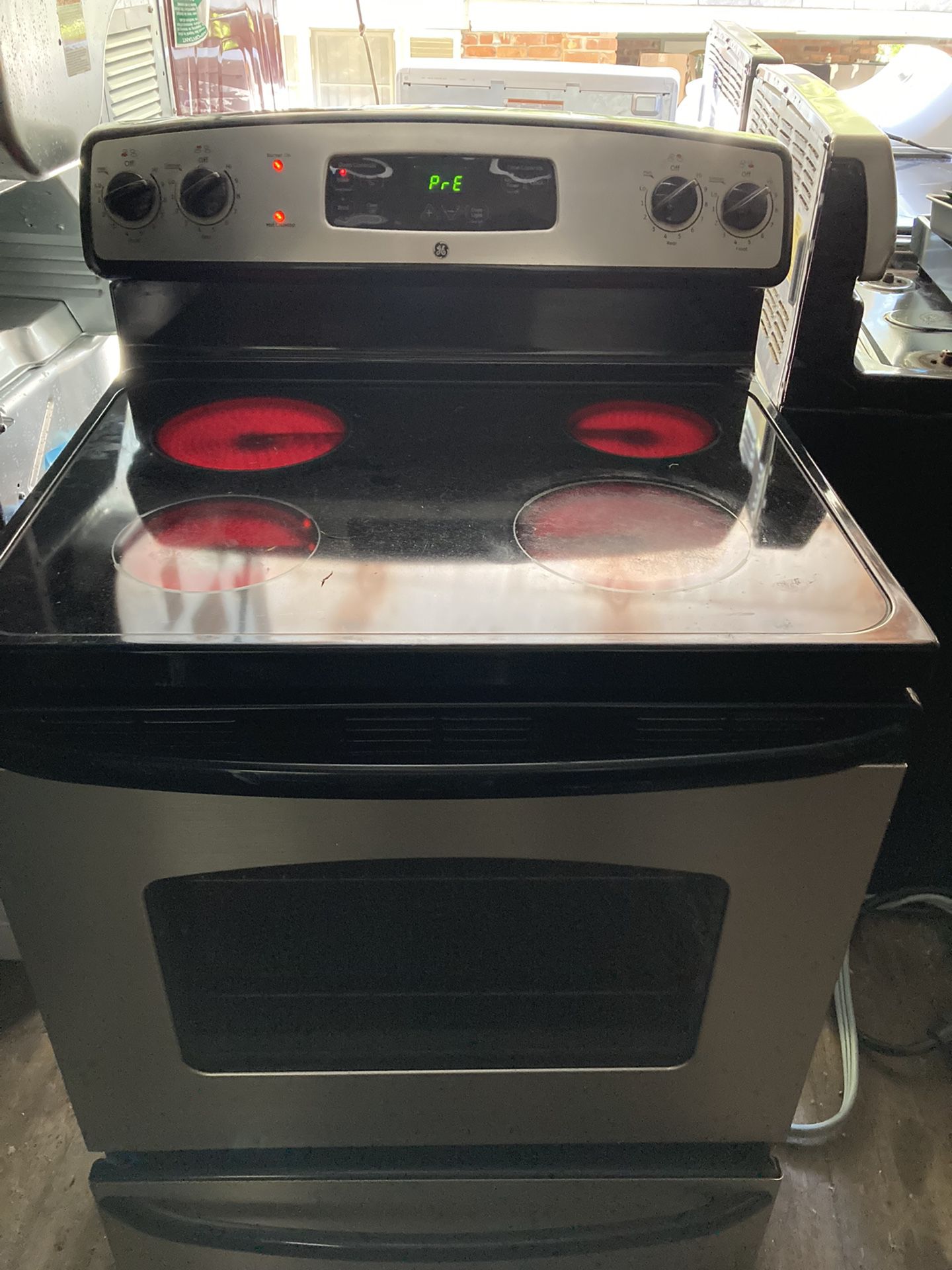GE stainless steel glass top stove electric $275 pick up in Decatur Georgia
