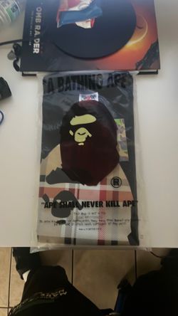A Bathing Ape (BAPE) Burberry-inspired Check Ape Head T-shirt in black.Size Medium