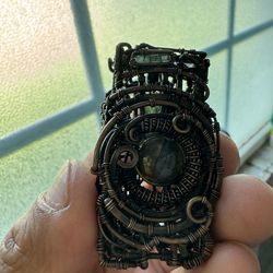 Hand wrapped pendant.